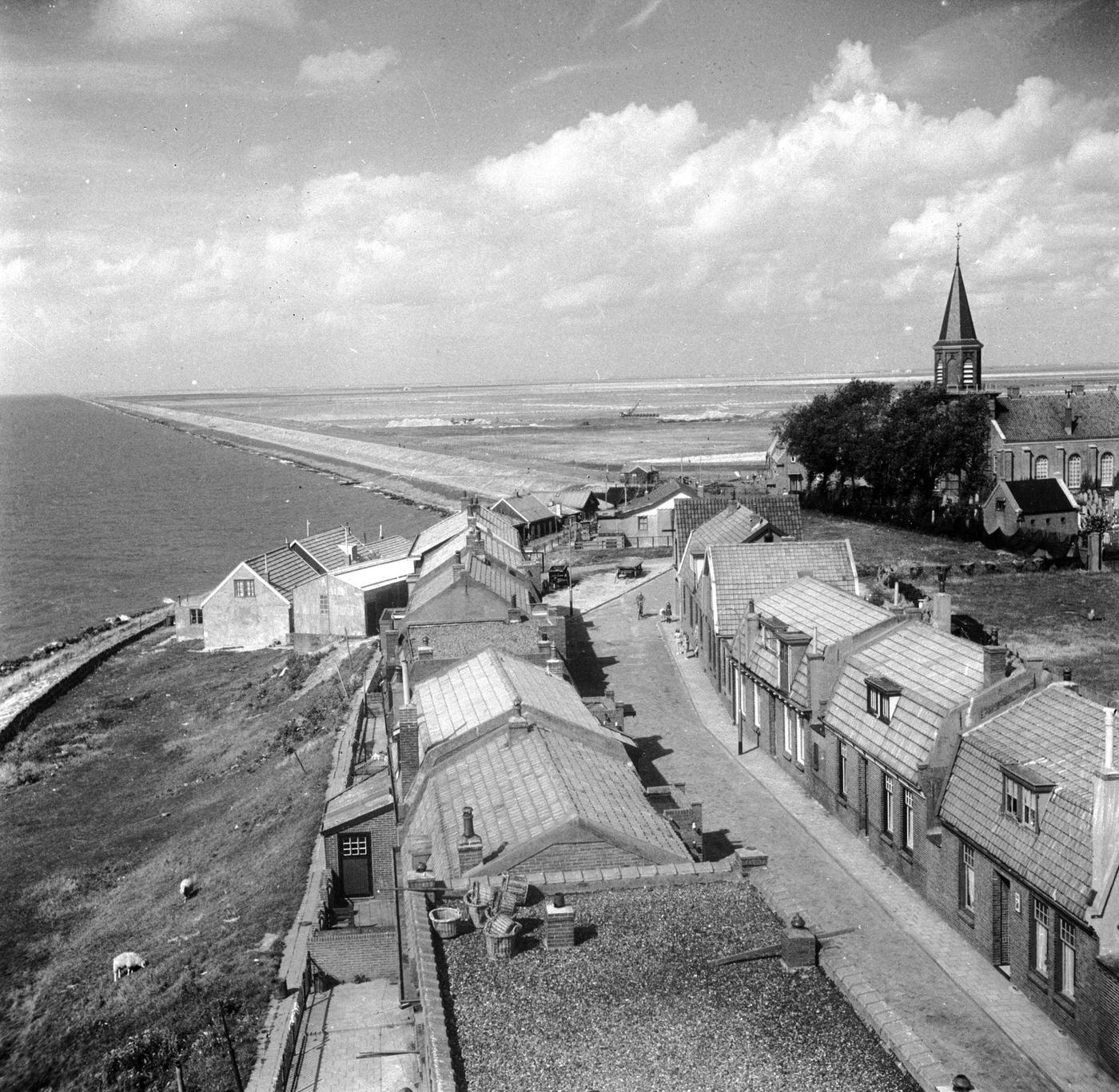 #48 Land stretching to the south of the Afsluitdijk, one of Holland’s busiest roads. The land, the Zuider Zee, was once a vast freshwater lake, now a fertile plain.