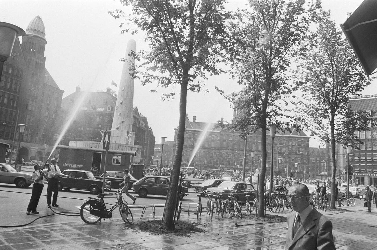 #126 Fire brigade spraying trees wet on Dam due to heat on June 23, 1976