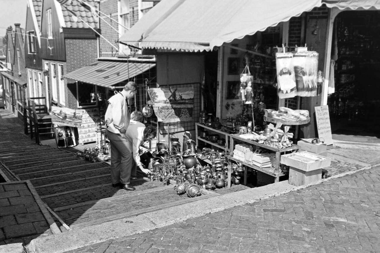 #3 Tourists browsing through the offerings of an antique shop in Volendam, The Netherlands, in 1971.