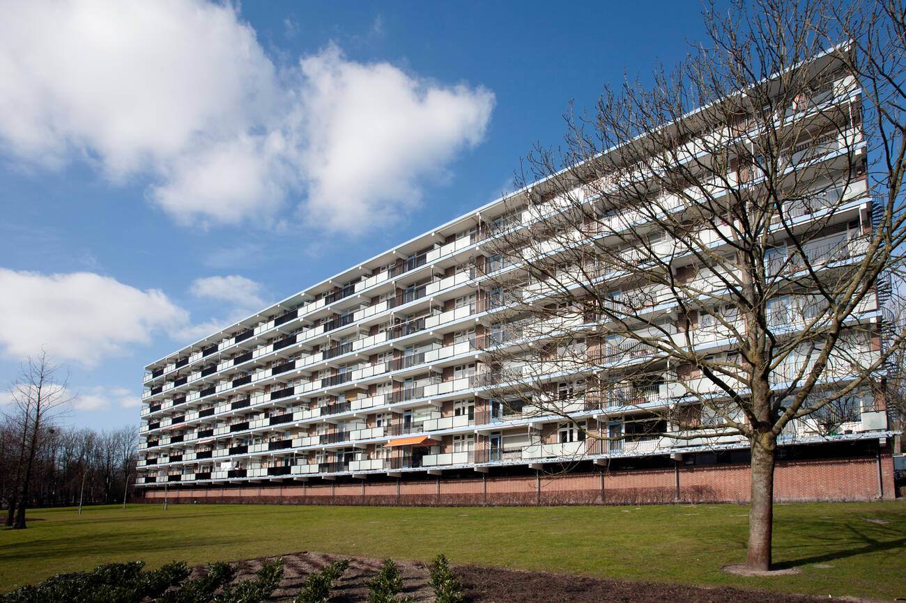 #23 An apartment block from the 1970s in a green environment, with many apartments being used for social housing and the elderly.