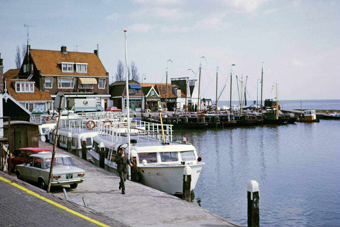 #35 Volendam, Netherlands in 1973: Tourist boats and fishing boats side by side at the quayside of Volendam.