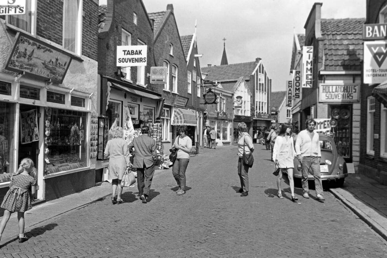 #47 Tourists and passersby in the streets of Monnickendam: A lively scene of tourists and passersby in the streets of Monnickendam, The Netherlands, in 1971.