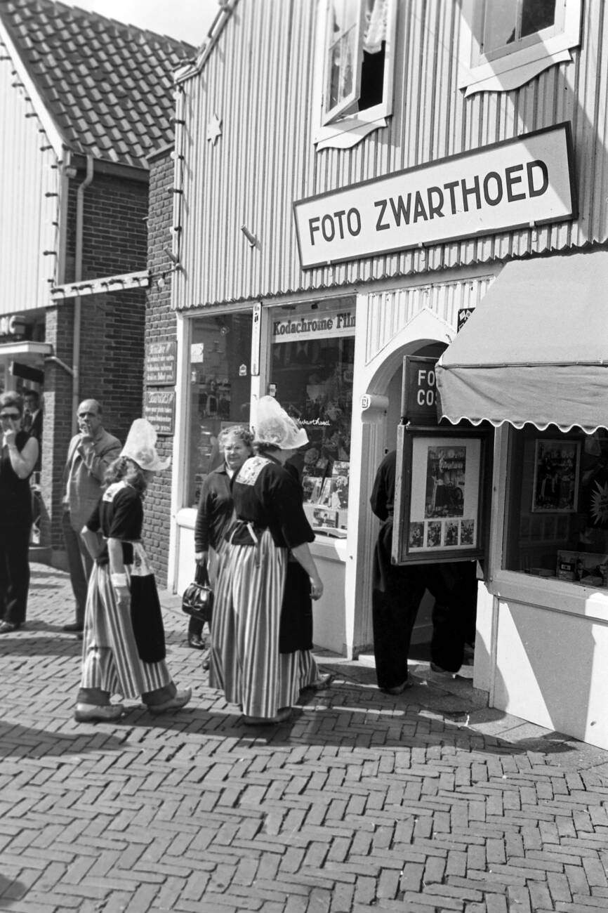 #55 Family in traditional Dutch clothing walking through the streets of Monnickendam, The Netherlands in 1971