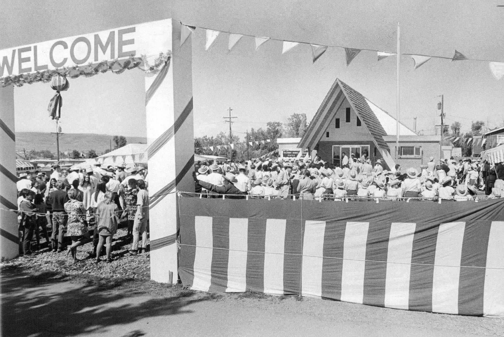 #67 Hundreds welcome opening of new church; those attending the celebration wore cowboy hats, boots, and “sheriff’s badges” at the carnival-like event.