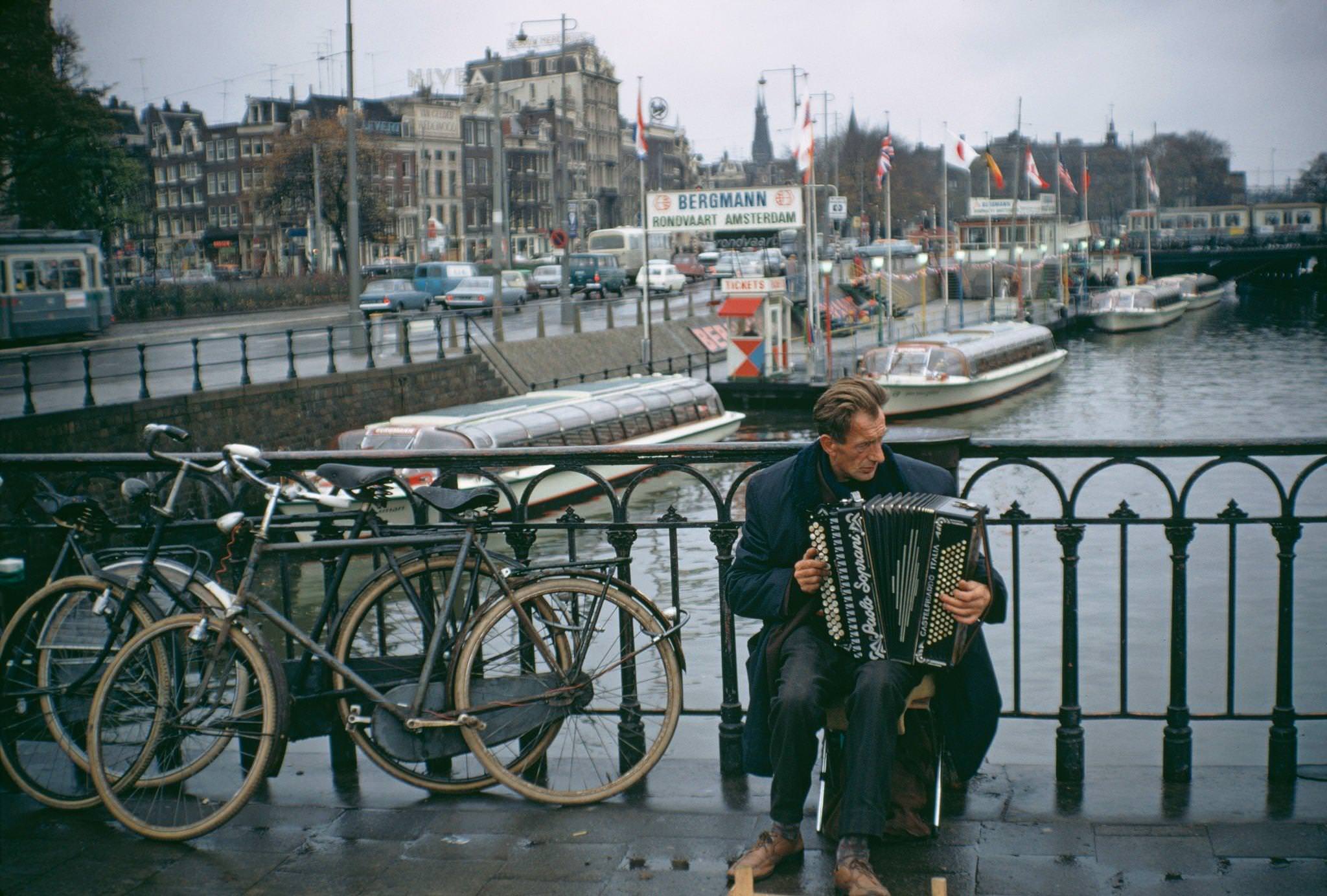 #78 A busker near the Centraal Railway Station in Amsterdam, capital city of the Netherlands, 1970.