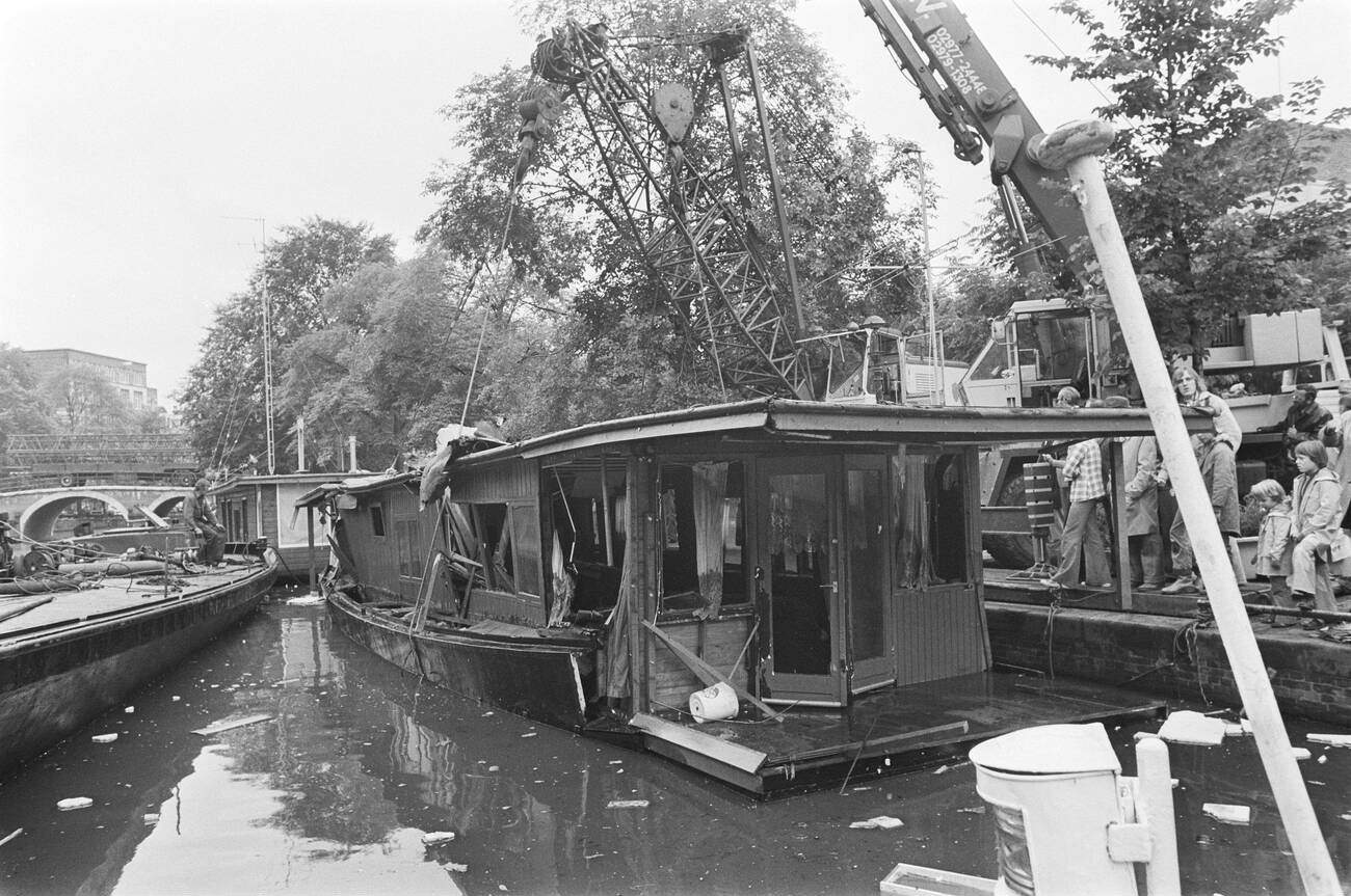 #82 A houseboat being lifted out of the water in Amsterdam on July 30, 1976.