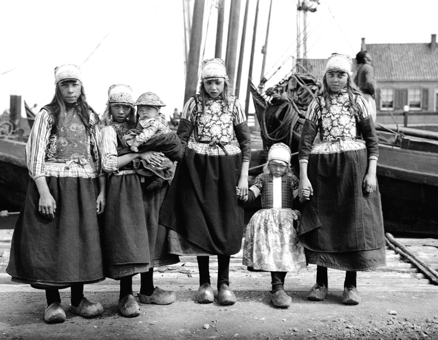 #111 Marken girls, Marken, Netherlands. Marken is (was) an island in the Zuiderzee. Because of its relative isolation, Marken evolved its own distinctive costume and architecture.