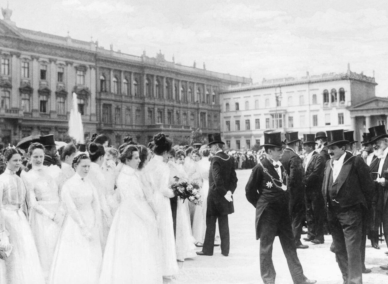 #13 A group of white-clothed “Ehrenjungfrauen” (Ladies of Honour) are awaiting the visit of Queen Wilhelmina of the Netherlands, 1900
