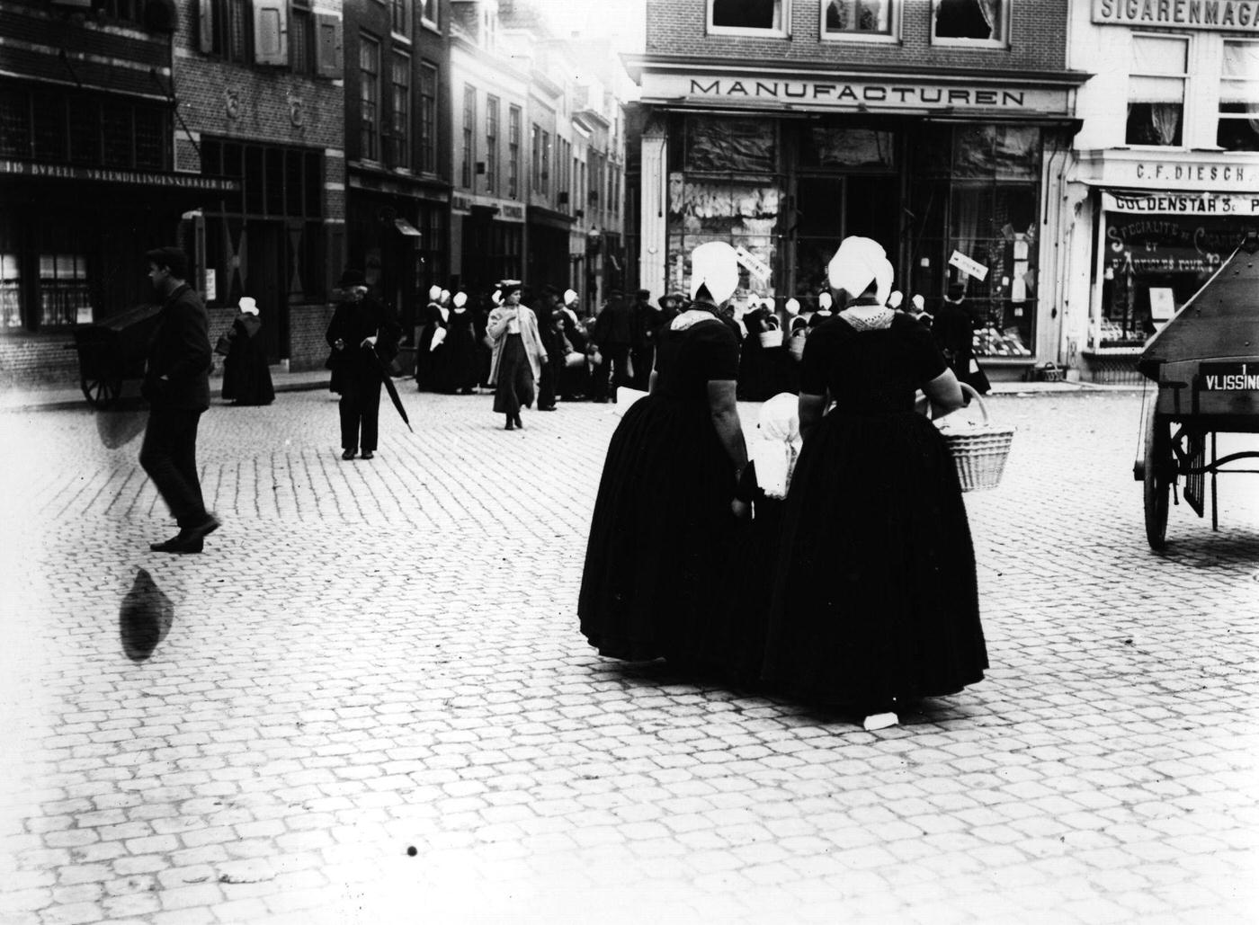 #86 Women shopping in a Dutch town, Netherlands, 1900.