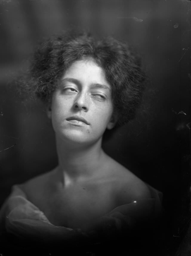 #24 Portrait of woman with eyes half shut, 1910