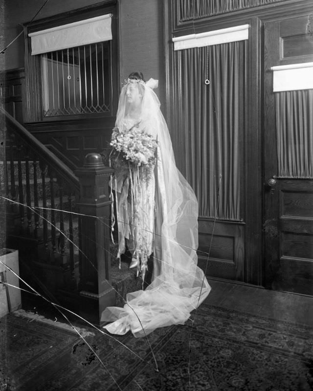 #26 Portrait of a bride at the bottom of residential stairs, 1915