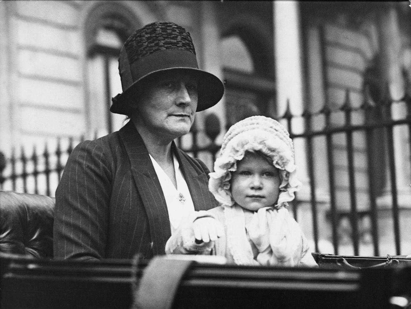 #13 Princess Elizabeth and her nanny Clara Knight, seated together in a carriage for a drive from the Duke of York’s house in Piccadilly, London, 1928.