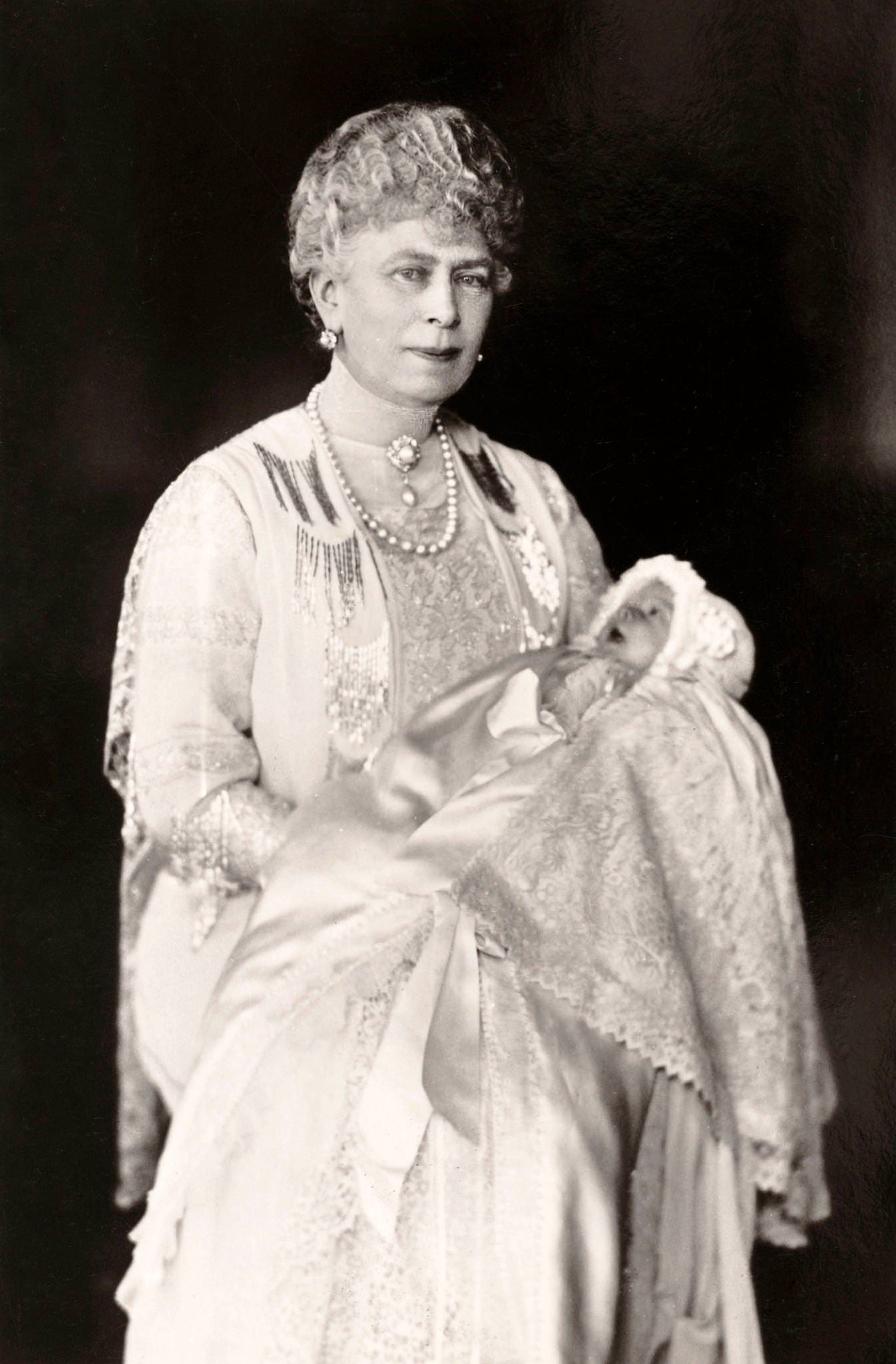 #5 Queen Mary holding her grand-daughter, Princess Elizabeth Alexandra Mary who became Queen Elizabeth II, published in London, 1926.