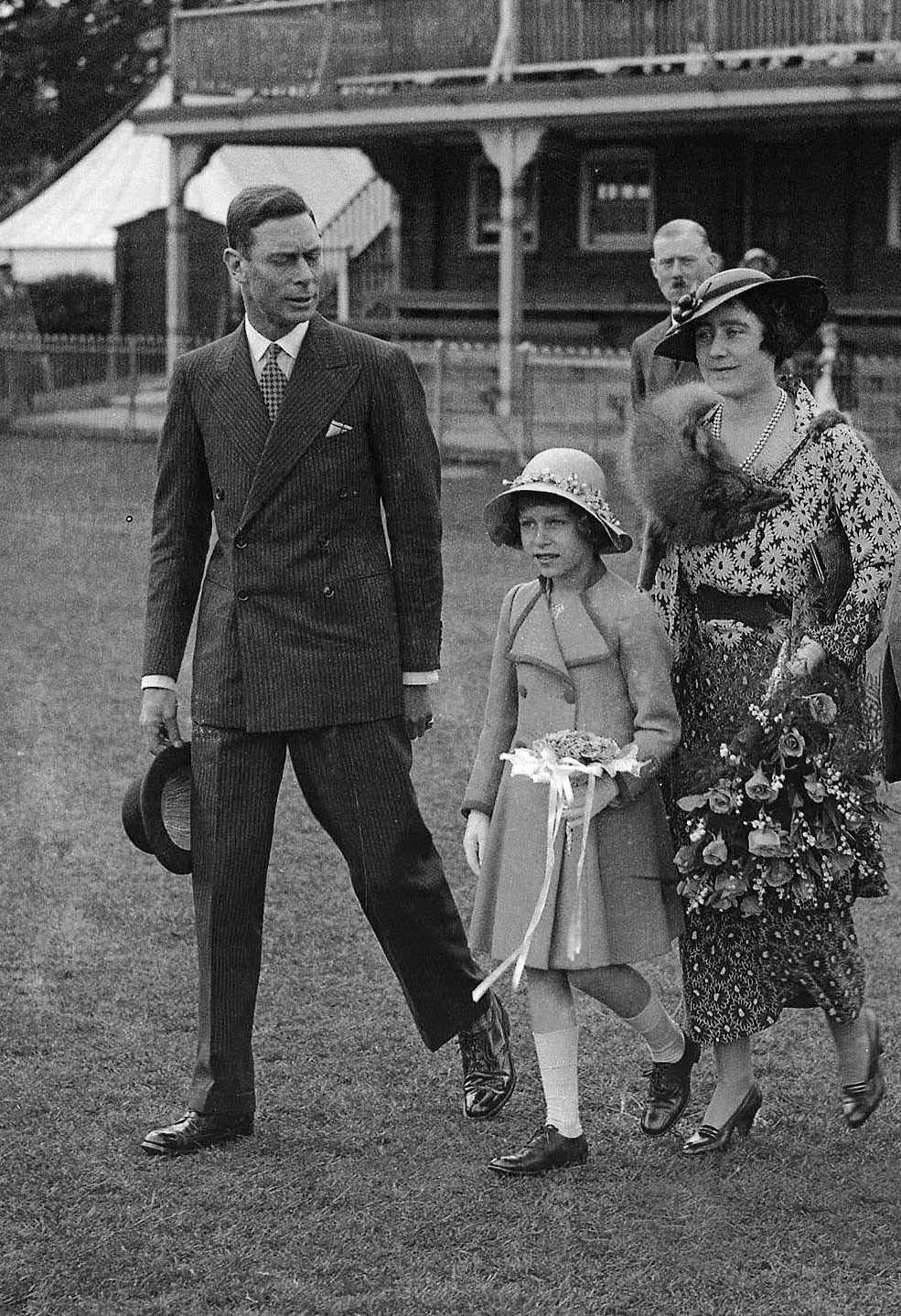 #77 The Duke and Duchess of York, with Princess Elizabeth, later Queen Elizabeth II, at the Windsor Royal Horse Show, 1935