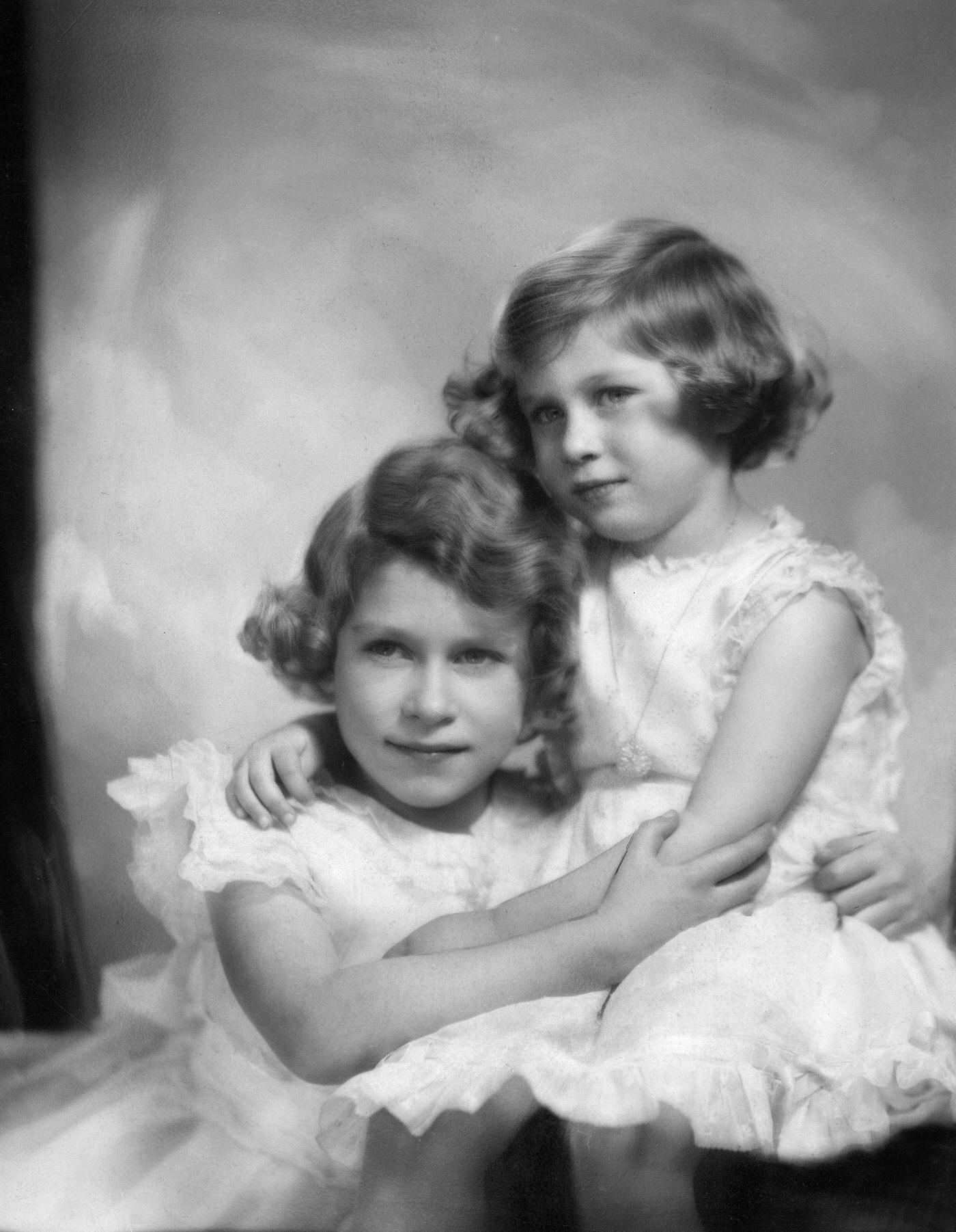 #90 Queen Elizabeth II with her sister Margaret, 1953