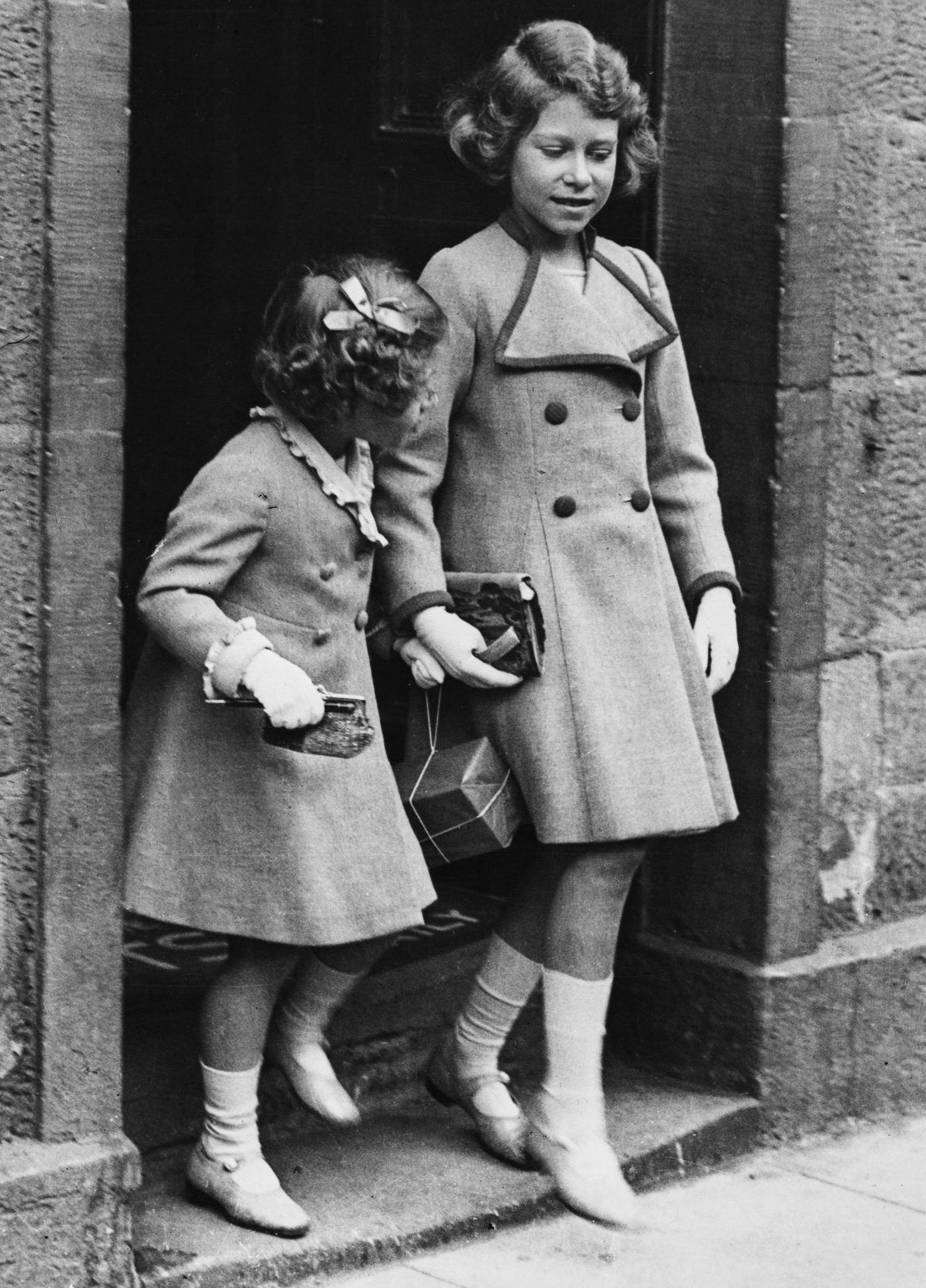 #92 Princess Elizabeth with her corgi, 1936.