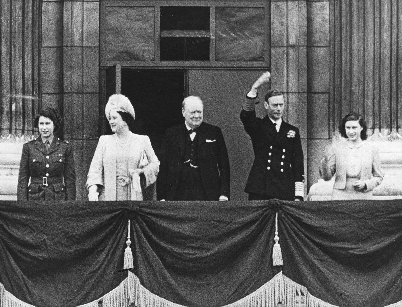#114 King George VI, Queen Elizabeth, Princess Elizabeth, and Princess Margaret at the Victory in Europe Day celebrations, 1945