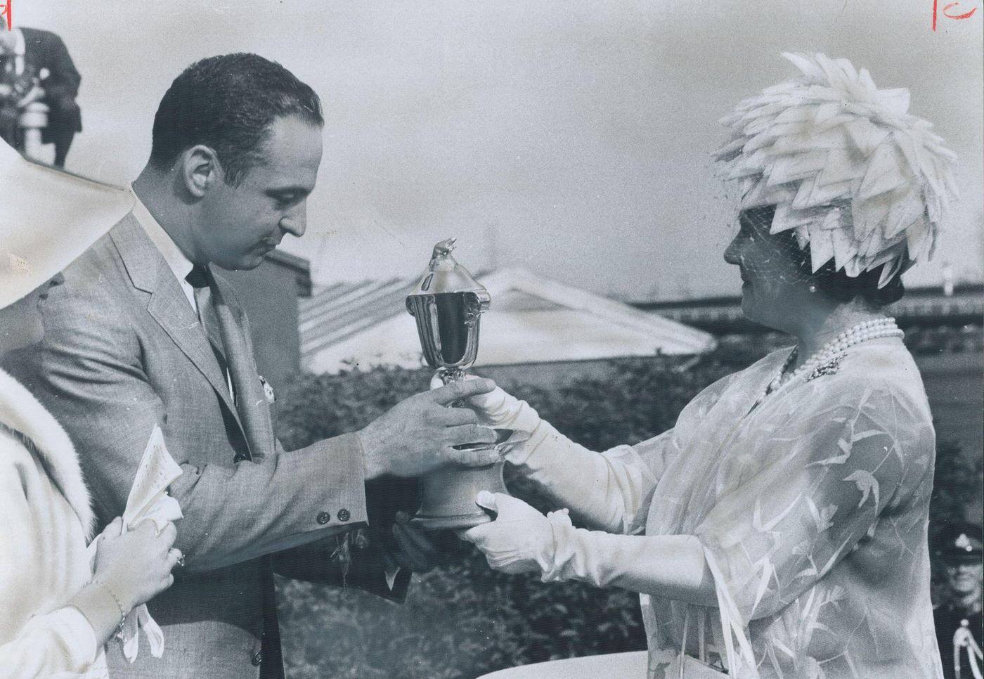 #118 Queen’s Plate trophy for winning colt Whistling Sea was presented to Calgary owner Paul Olivier by the Queen Mother in Canada, 1974.