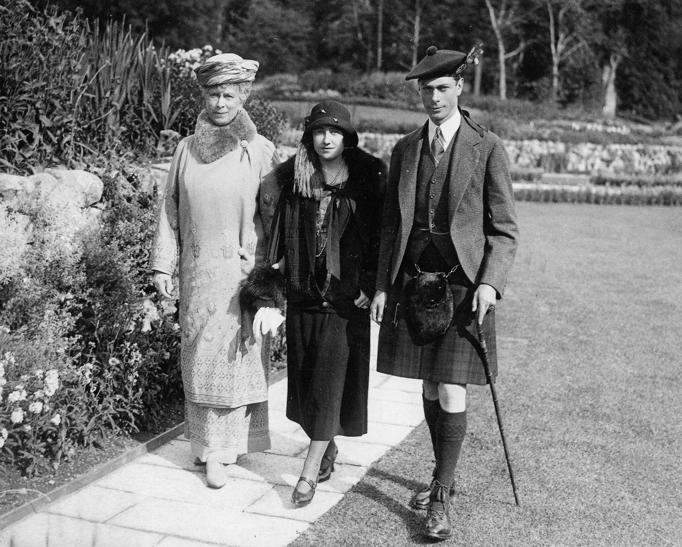 #52 Queen Elizabeth when she was the Duchess of York with her husband the Duke of York in the gardens at Balmoral Castle, Scotland.