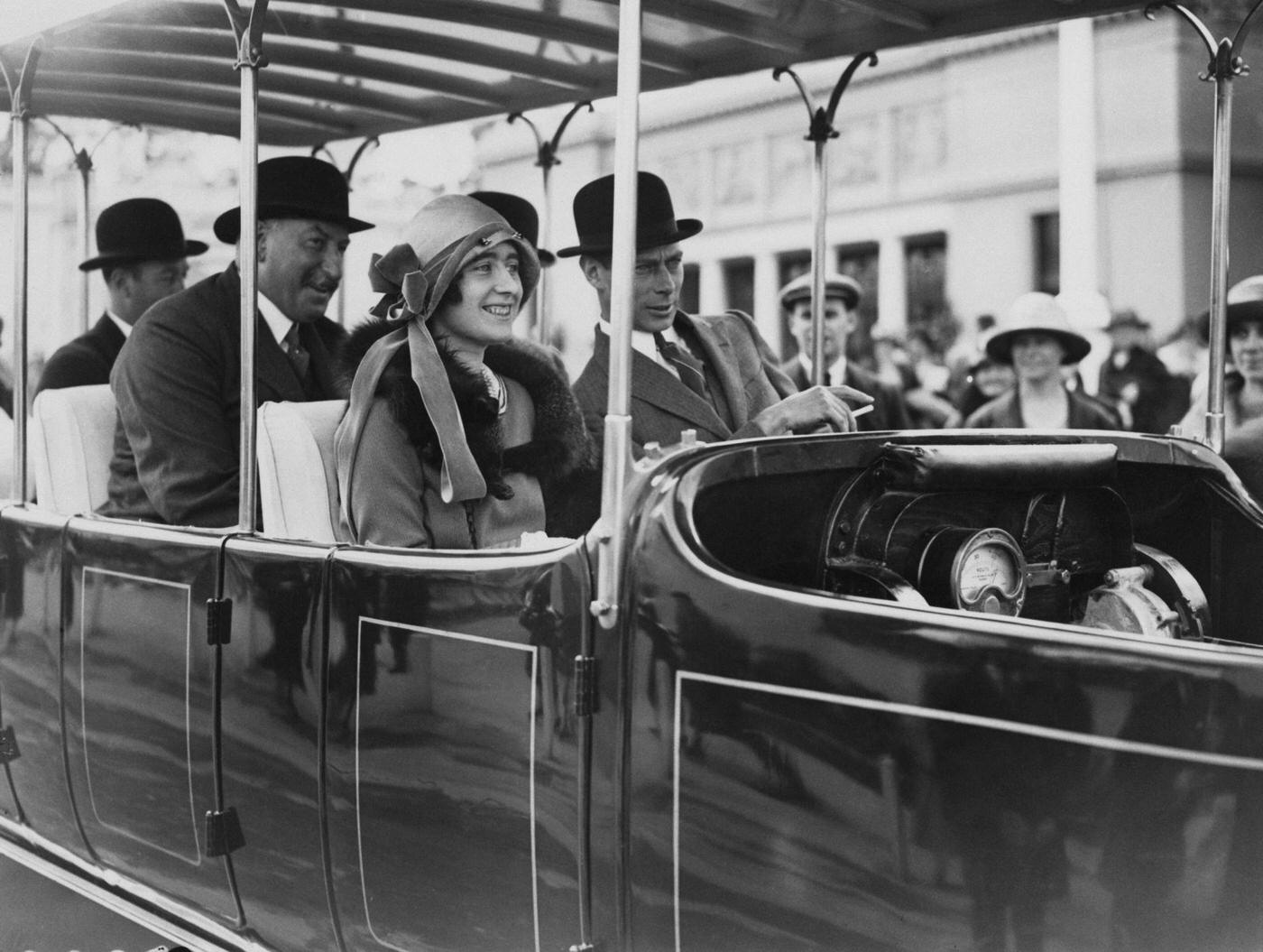 #60 The Duke and Duchess of York take a ride on a ‘Railodok’ electric car at the British Empire Exhibition, Wembley, London, 29th May 1925.
