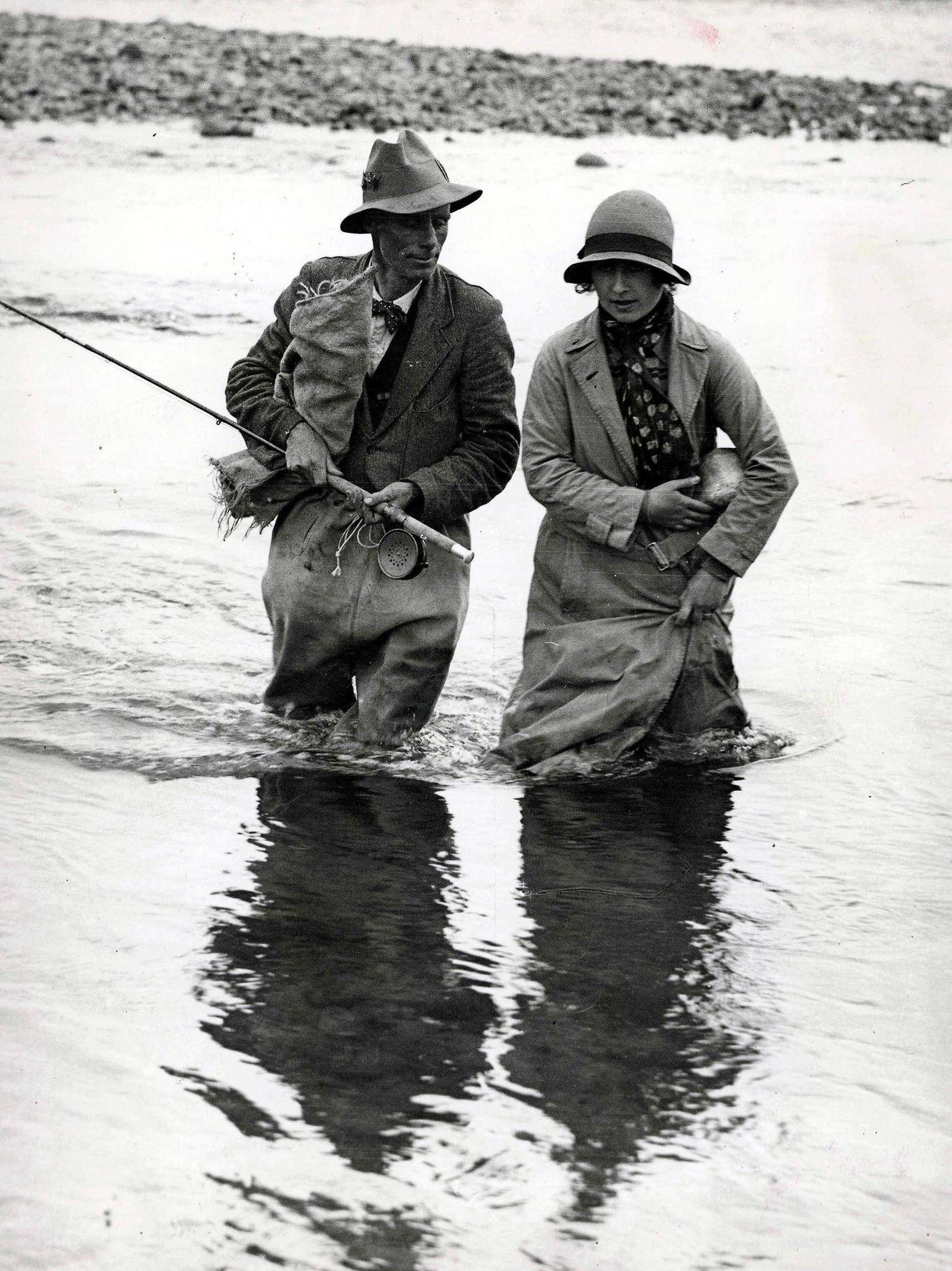 #68 The Queen Mother fishing for trout during a fishing expedition at Tokaanu, New Zealand.