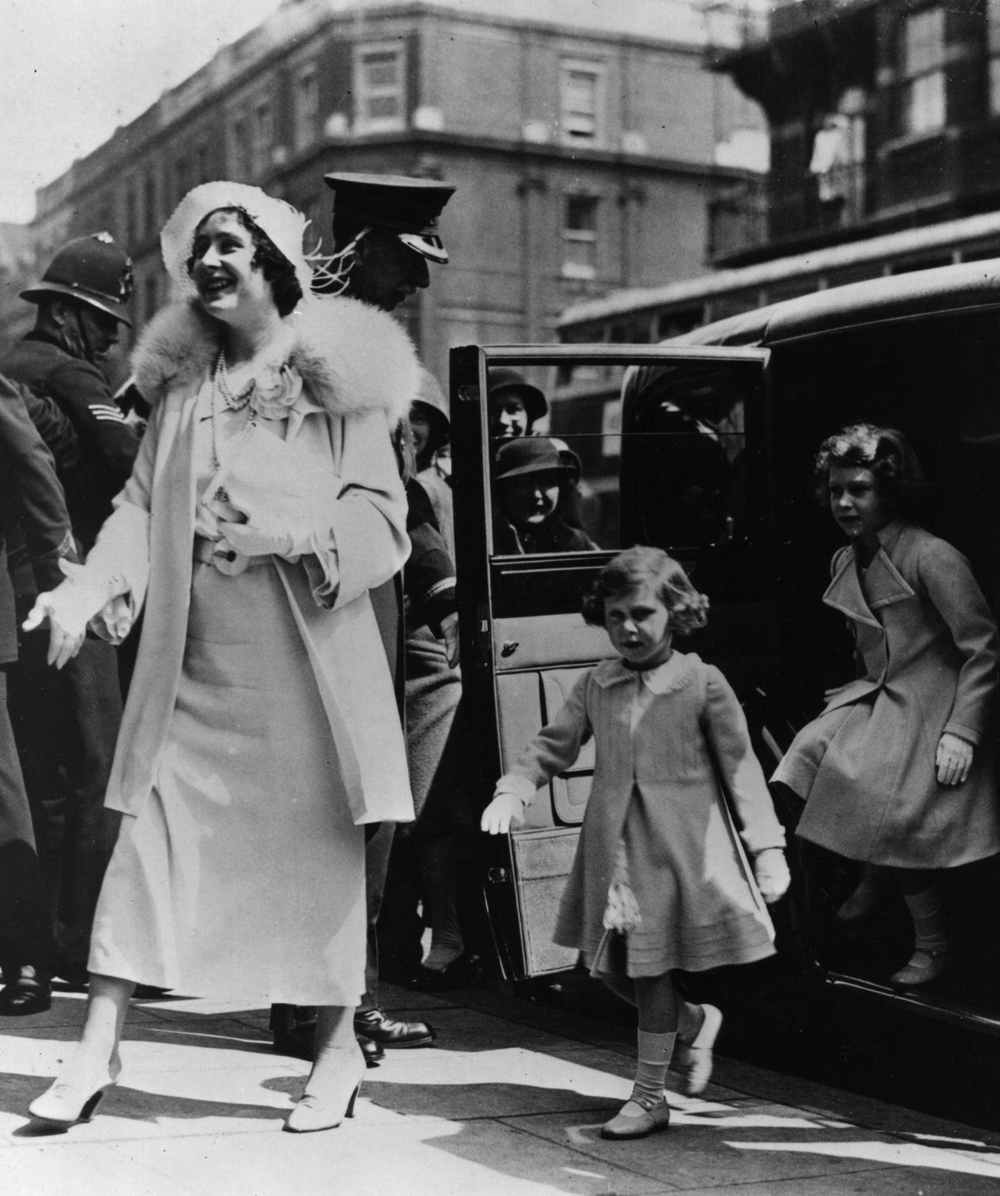 #79 Queen Elizabeth with Princesses Elizabeth and Margaret arriving at the Royal Tournament, Olympia, 1935.
