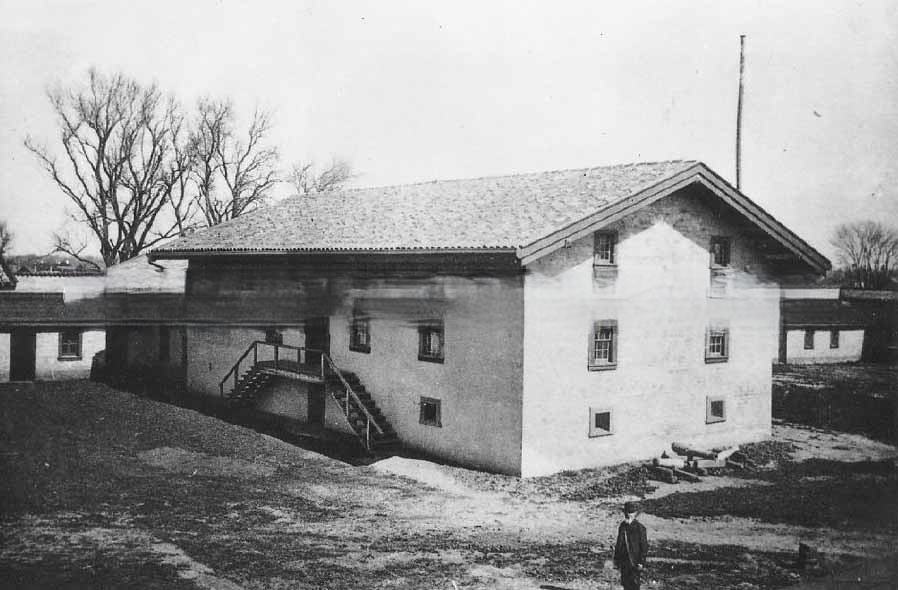#69 Sutter’s Fort shortly after restoration, interior view of grounds showing central building, 1891