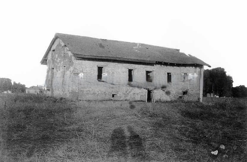 #73 View of the central building at Sutter’s Fort before restoration, 1890