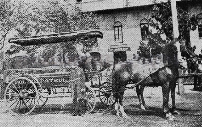 #135 City Police Patrol wagon in front of the City Jail and City Justice Court in the old City Hall at Front and I Streets, 1890
