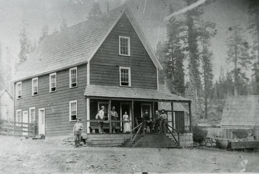 #226 Chaparral House with 7 people outside of it, 1898