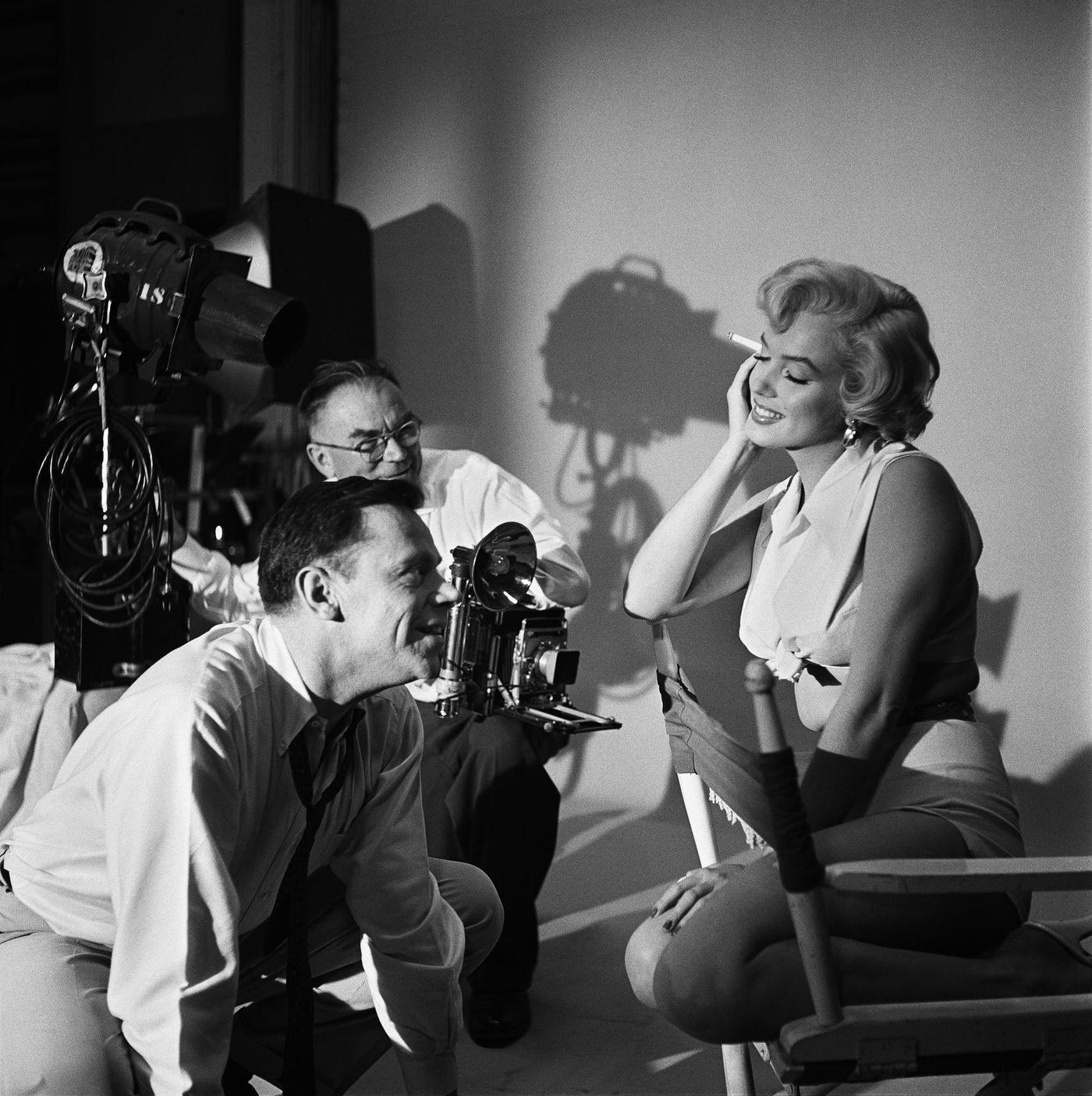 Marilyn Monroe with co-star Tom Ewell and photographer Frank Powolny in 1954 during the filming of “The Seven Year Itch”