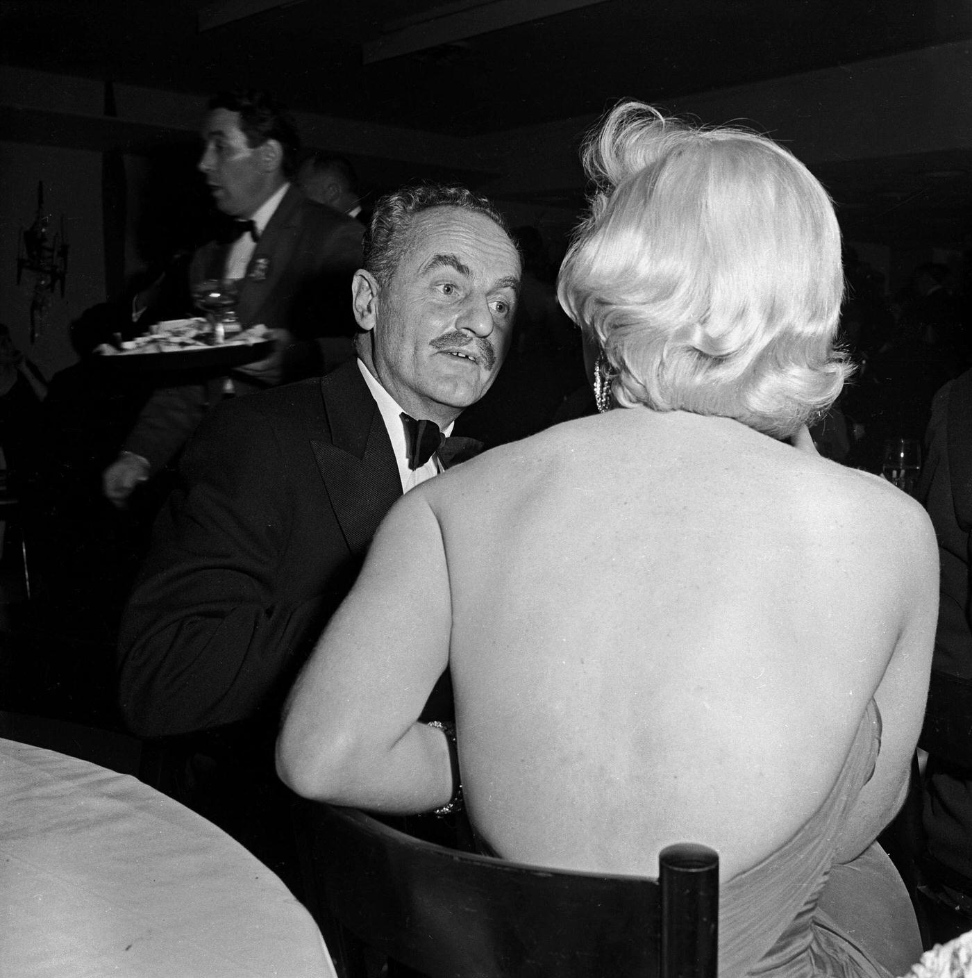 Marilyn Monroe with film producer Darryl Zanuck at the wrap party for the filming of “The Seven Year Itch” at Romanoff’s Restaurant in 1954