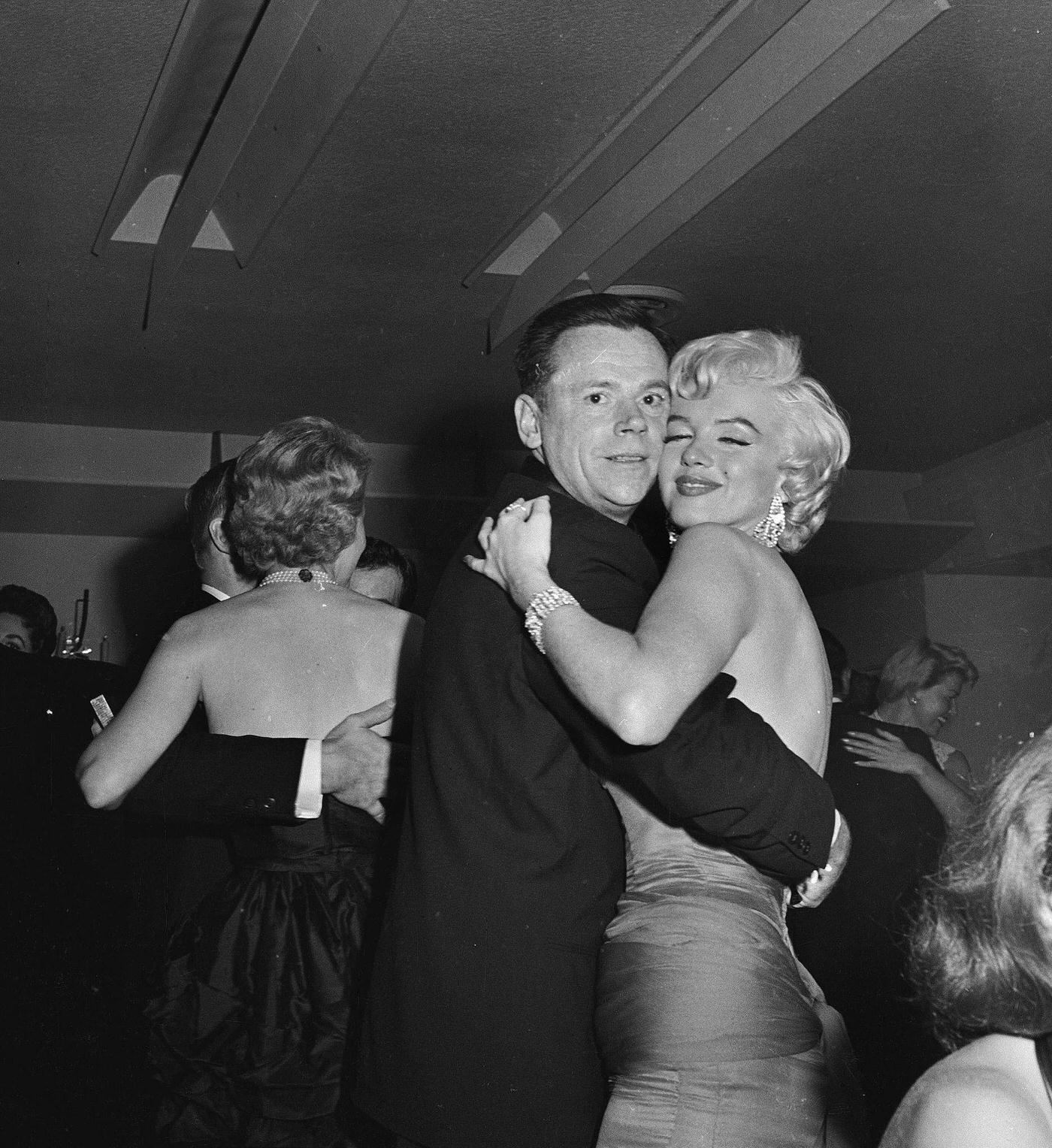 Marilyn Monroe dances with co-star Tom Ewell at the wrap party for the filming of “The Seven Year Itch” at Romanoff’s Restaurant in 1954