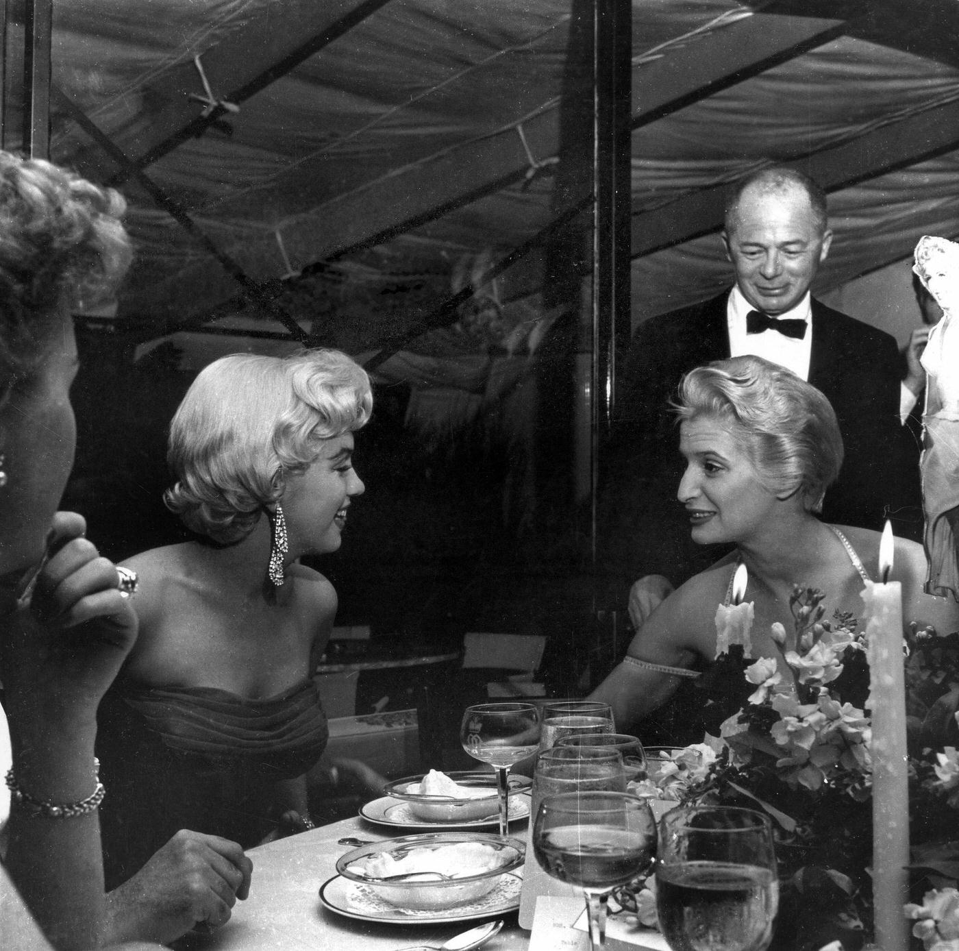 Marilyn Monroe with director Billy Wilder and Joan Axelrod, the playwright George Axelrod’s wife, at the wrap party for the filming of “The Seven Year Itch” at Romanoff’s Restaurant