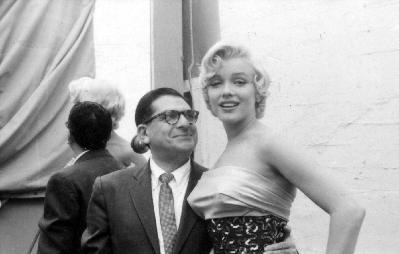 Marilyn Monroe with newspaper columnist Sidney Skolsky on set while working on the Dazzledent Toothpaste commercial sequence in 1954 for “The Seven Year Itch”