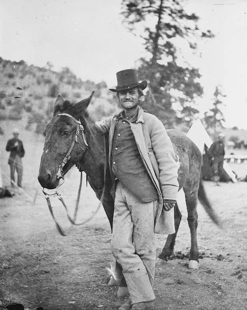 #108 Correspondent Fred W. Loring and his mule were photographed in Arizona in 1871. Loring was killed by Apaches just two days after this picture was taken.