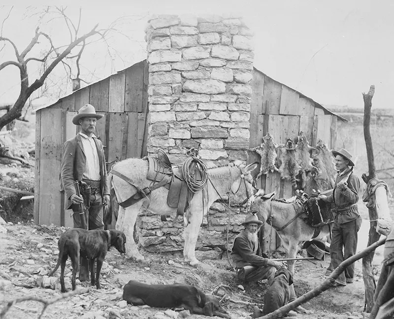 #110 Trappers and hunters, including the Crab Tree boys and their father, with their dogs and burrows, are seen in Brown’s Basin, Arizona in this photograph from an unknown date.
