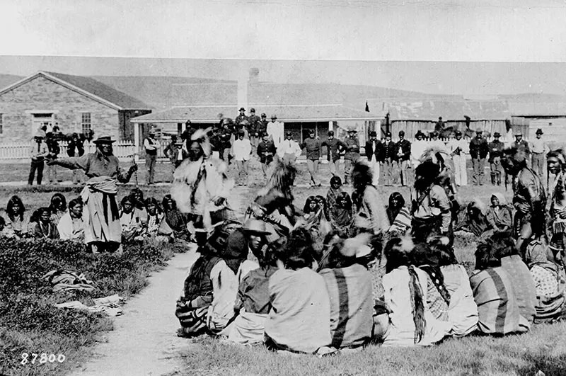#113 Shoshone tribe members are shown dancing on a Native American reservation in Ft. Washakie, Wyoming in 1892.
