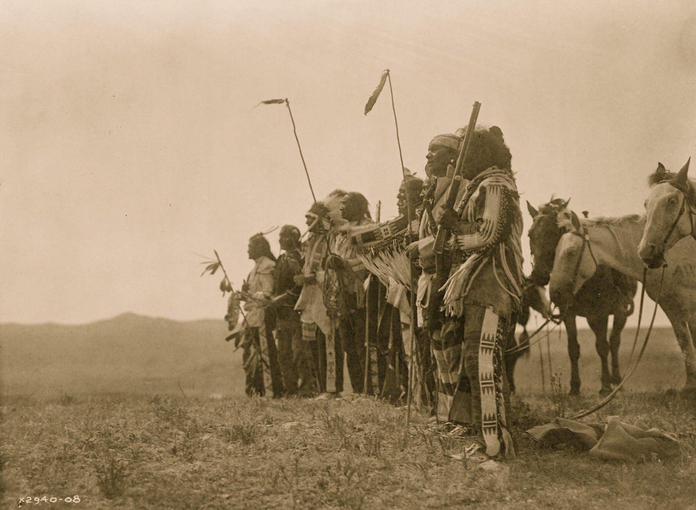 #3 Atsina men on a hill with their horses, 1908