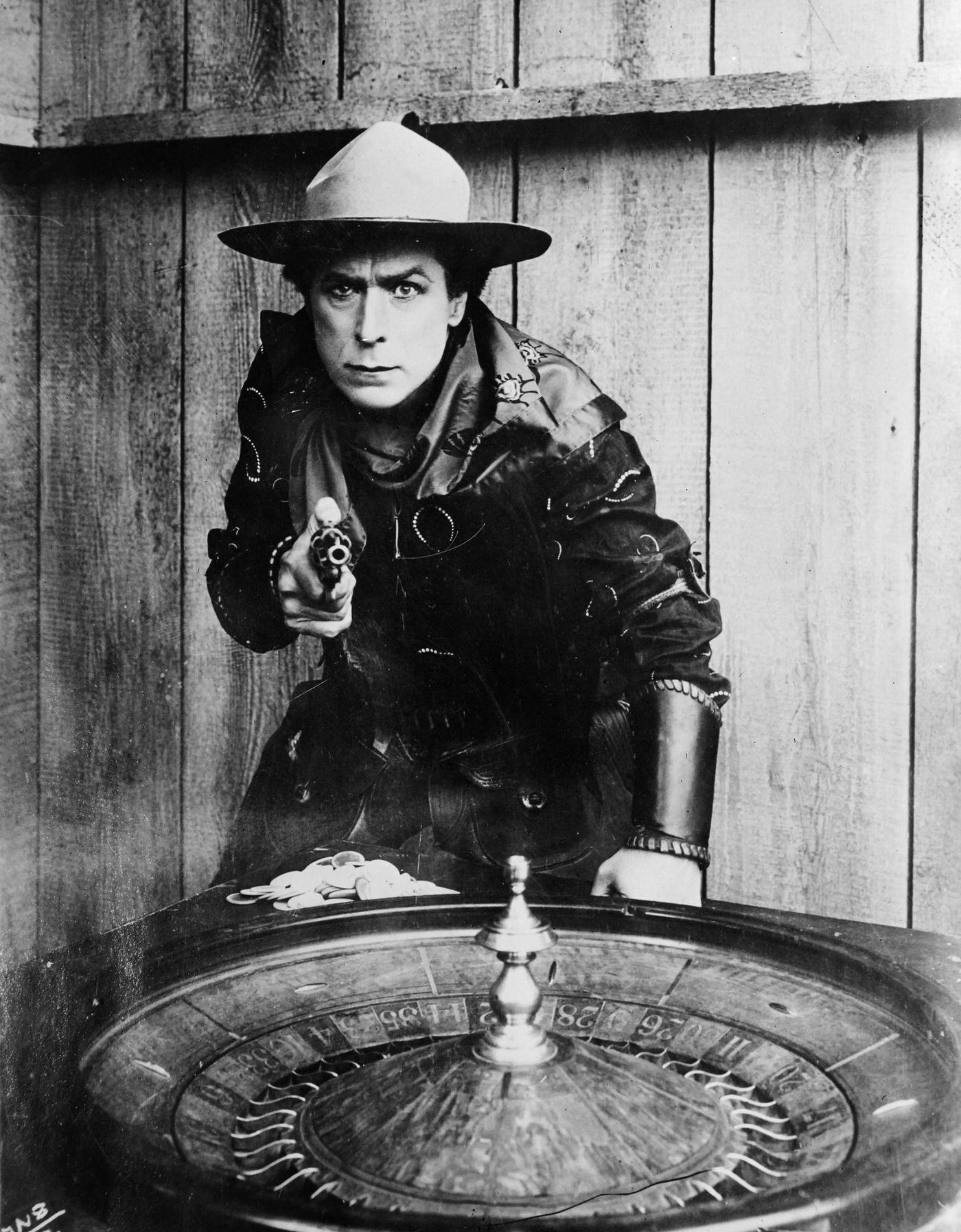 #21 William S Hart interpreting a cowboy at the Roulette table.