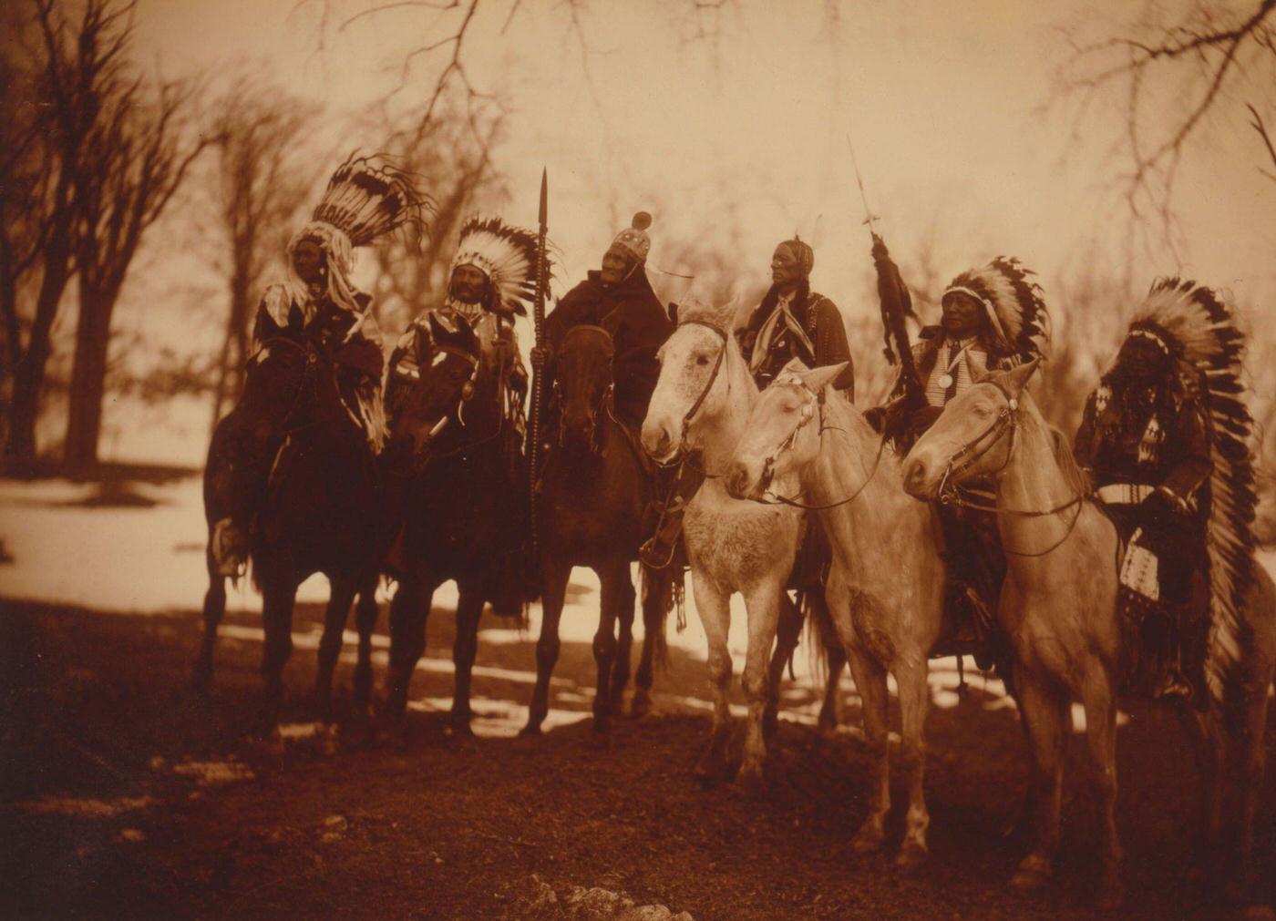 #24 Six tribal leaders (l to r) Little Plume (Piegan), Buckskin Charley (Ute), Geronimo (Chiricahua Apache), Quanah Parker (Comanche), Hollow Horn Bear, 1900