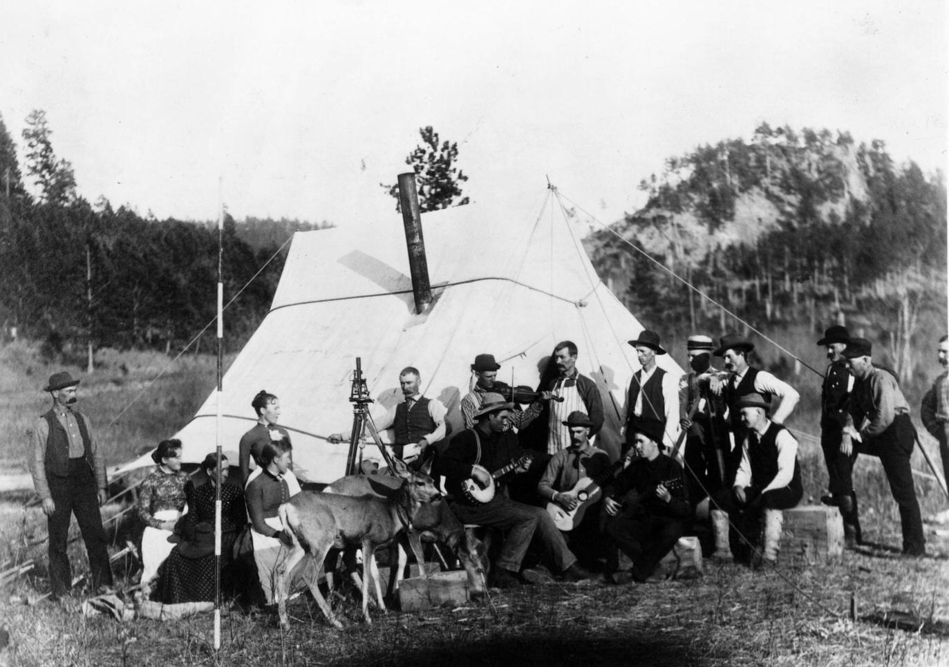 #57 Railroad Camp, United States: Railroad workers entertain visitors during happy hour at a railroad camp alongside a construction route in South Dakota.