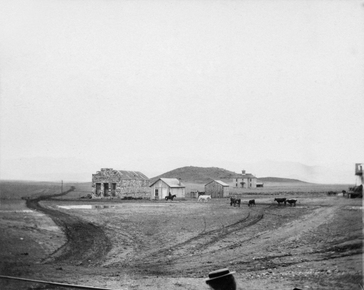 #71 On The Plains, view of a handful of buildings, in a small frontier town on the Plains, during America’s westward expansion era, nineteenth century.