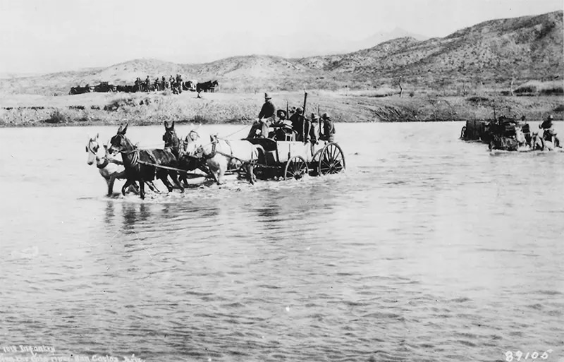 #77 Buckboard wagons crossing Gila River near San Carlos, Arizona in 1885.