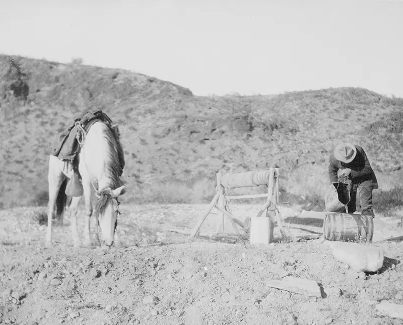 #78 A rider and his horse refresh themselves from a desert well 30 miles north of Palomas, Arizona in 1907.