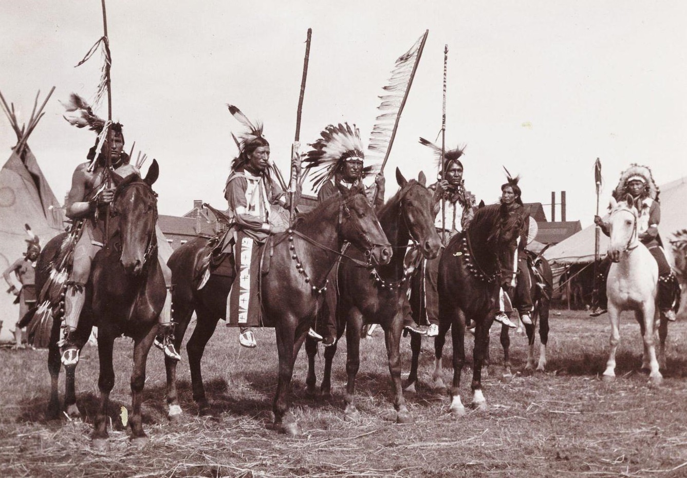 #1 A snapshot photograph of a group of mounted Native Americans, taken by an unknown photographer in about 1905.