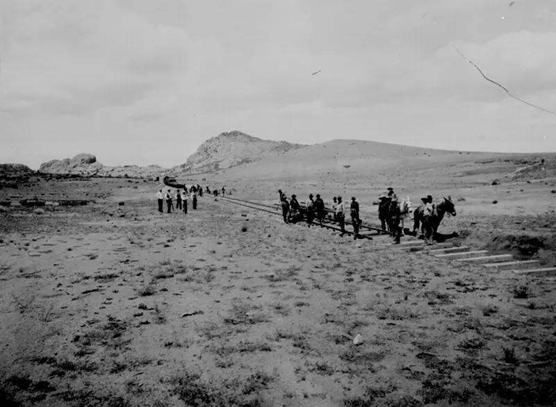 #89 Men lay down track for a new railroad, connecting the wild frontier with the world in Arizona in 1898.
