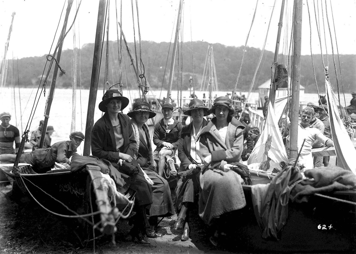 #19 Women sitting on beached skiffs at the Pittwater Regatta