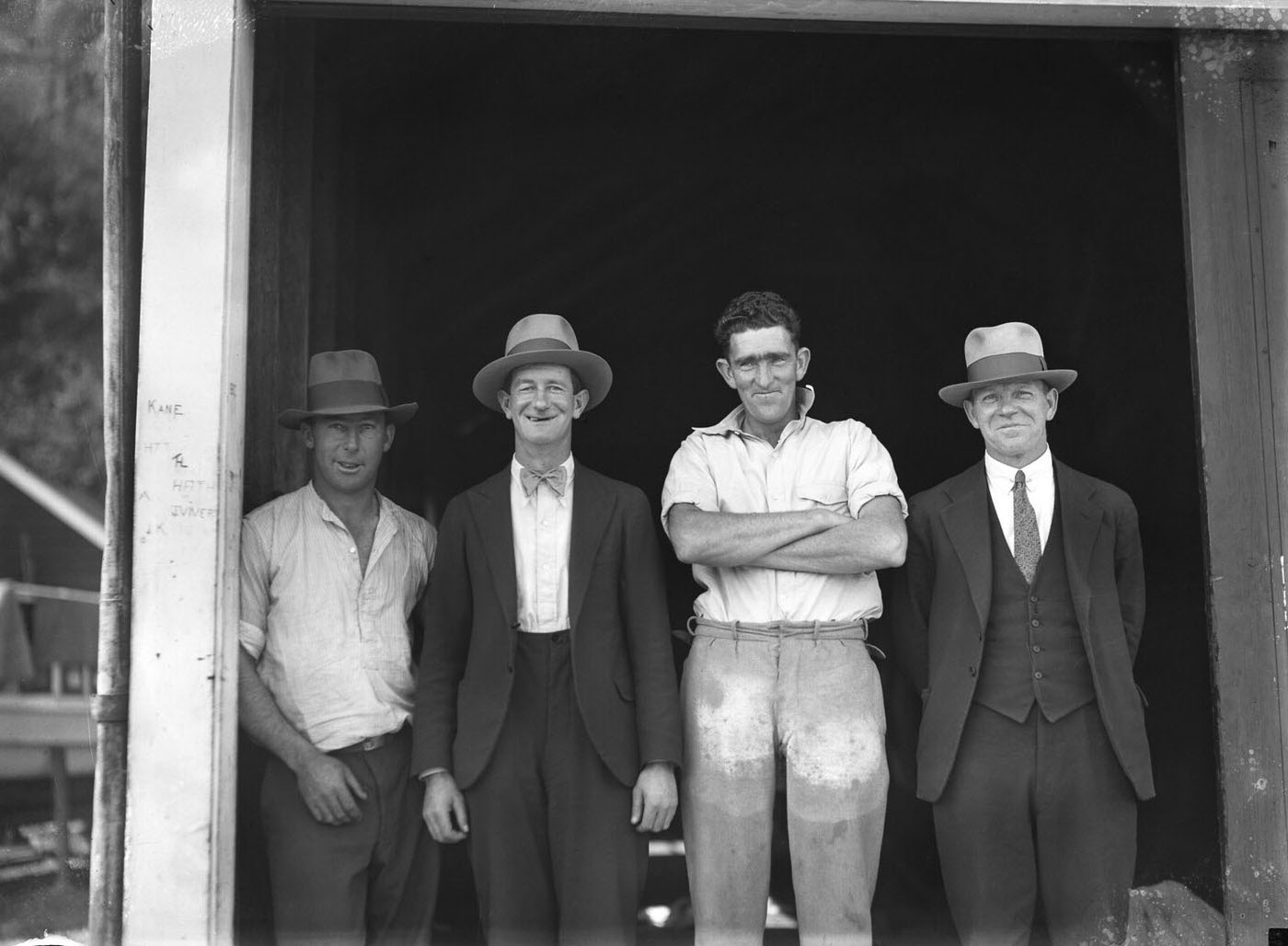 #45 Four men outside SCEGS boatshed, Berrys Bay
