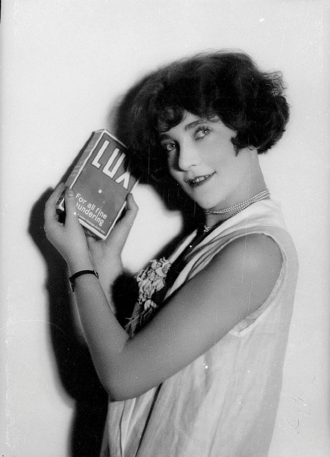 #3 Portrait of a woman holding a box of Lux laundry powder